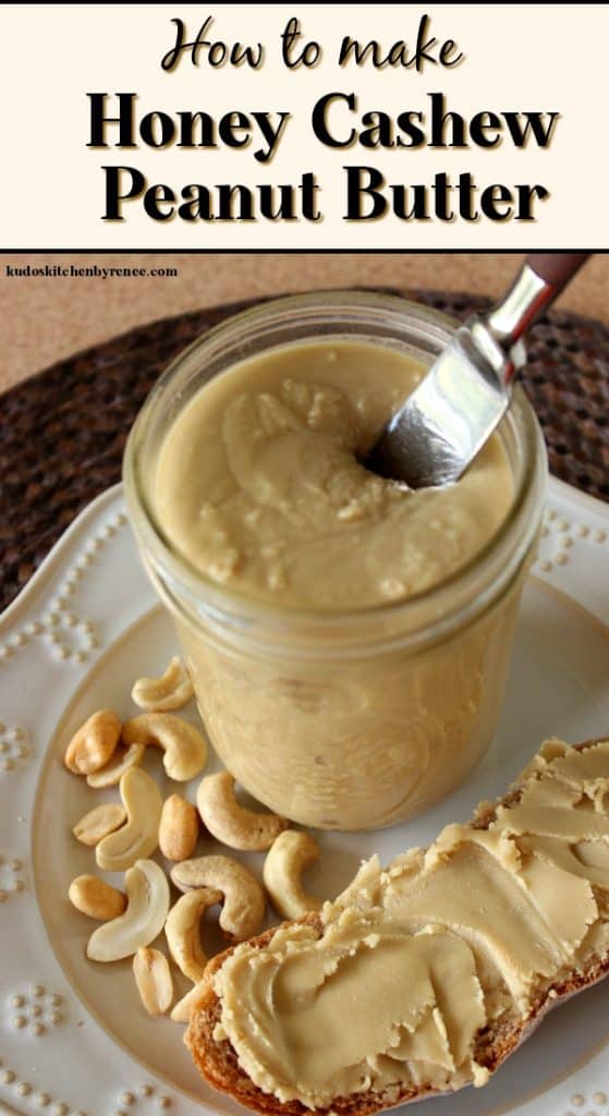 A jar of cashew peanut butter on a white plate with a knife sticking out of it.