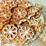 Fried Snowflake Rosette Cookies with Confectioners Sugar Dusting - kudoskitchenbyrenee.com