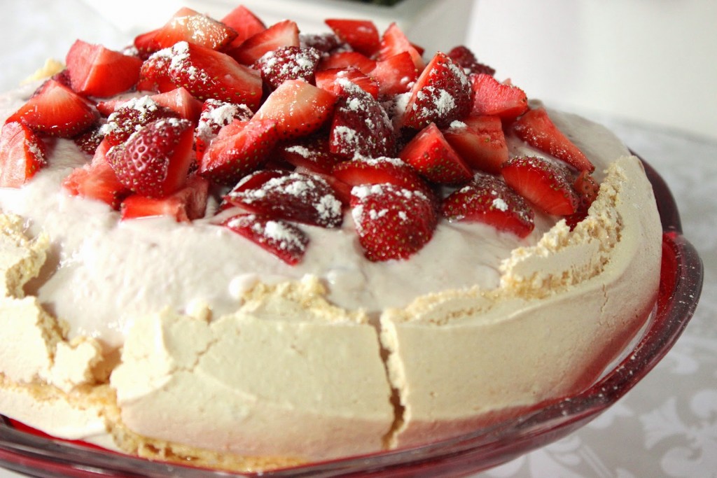 Fat-free Pavlova is crisp, light and topped with Chobani Greek yogurt and fresh strawberries.