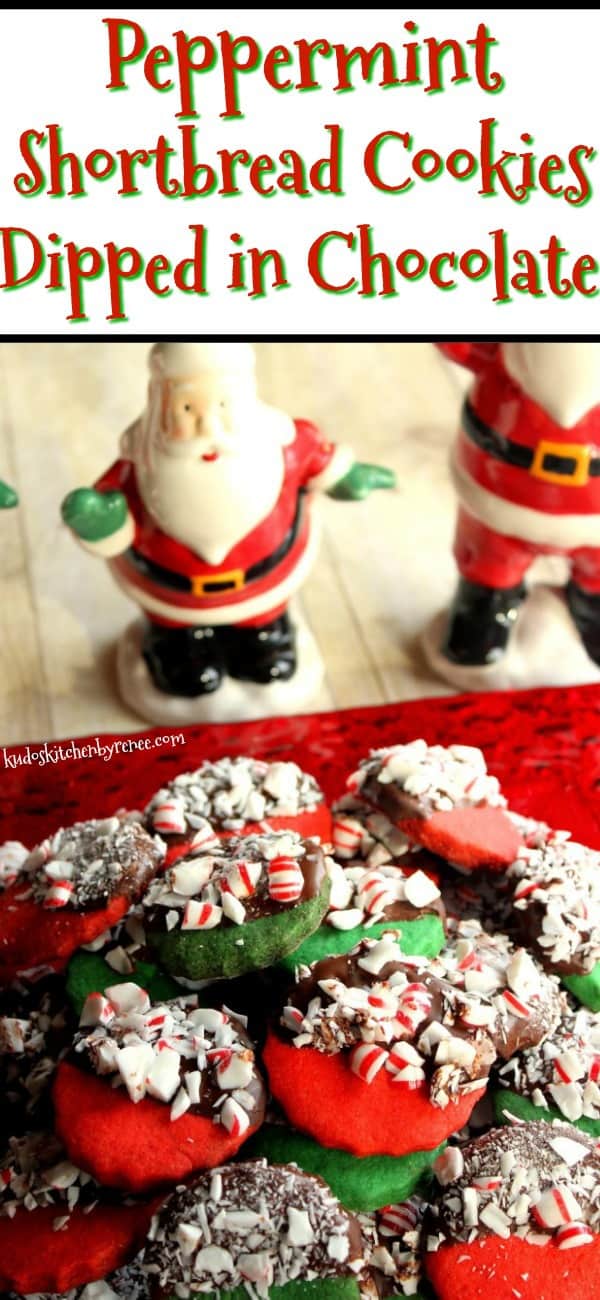 Red and Green Peppermint Shortbread Cookies on a red glass plate with Santa's in the background.