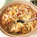 A round casserole dish filled with Baked Farro Casserole with Brussels sprouts and bacon.
