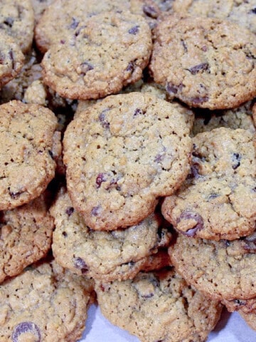 An overhead photo of a whole bunch of Chocolate Cherry Oatmeal Cookies.