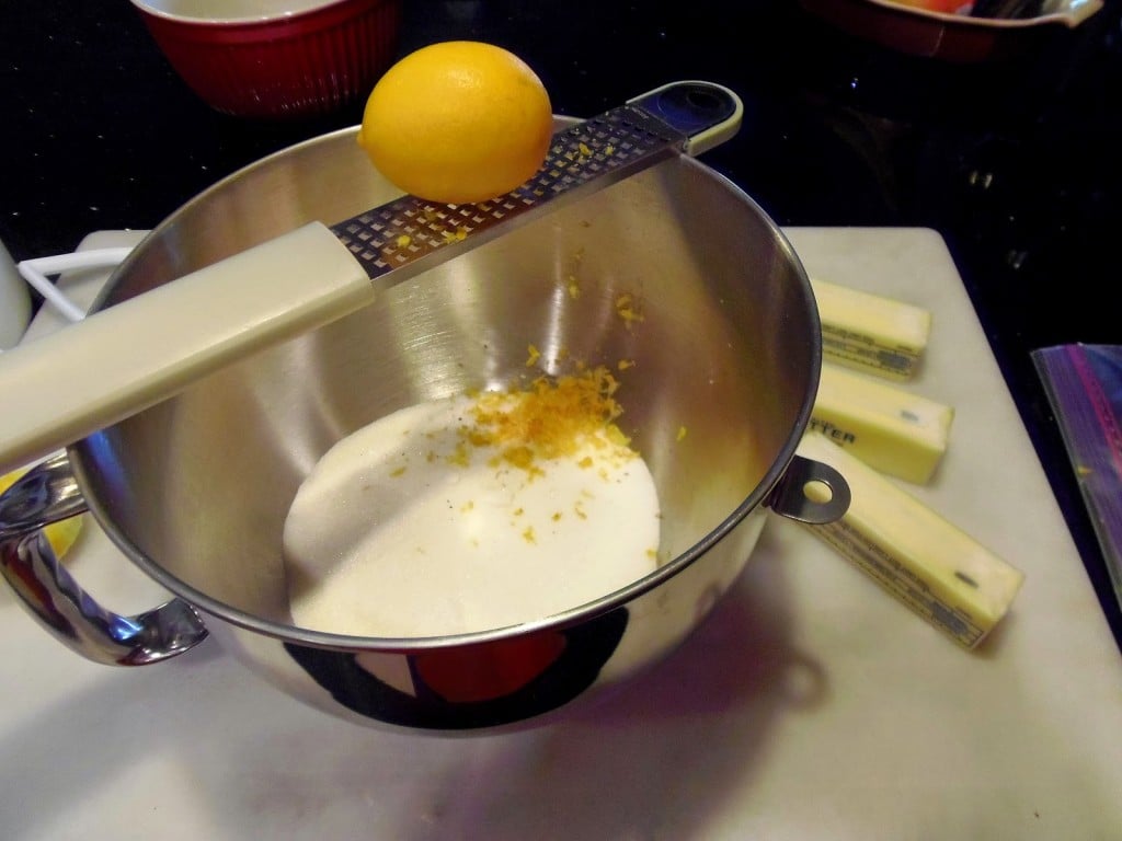 A bowl with fresh lemon zest and sugar.