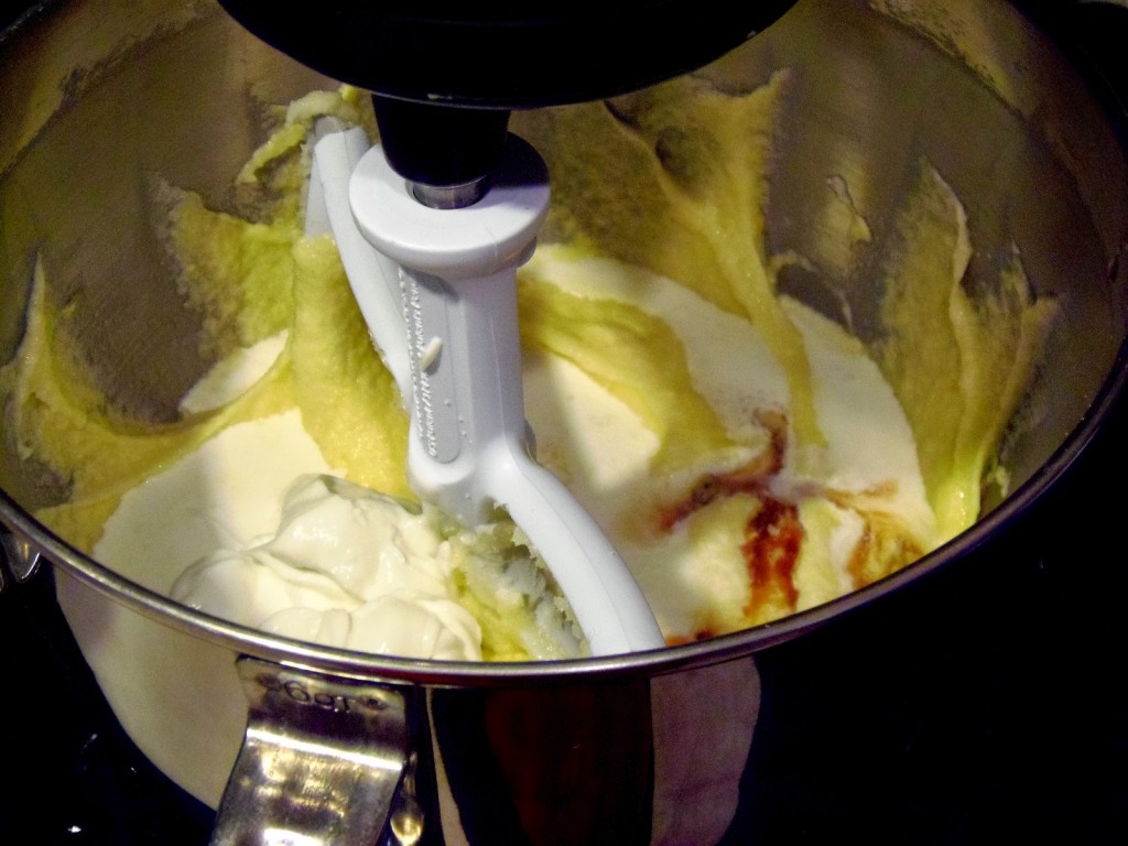 A batter being mixed in a stand mixer.