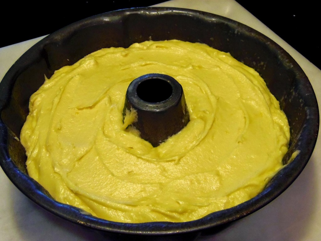 A yellow batter in a Bundt pan.