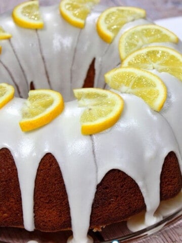 A Meyer Lemon Pound Cake on a glass platter.
