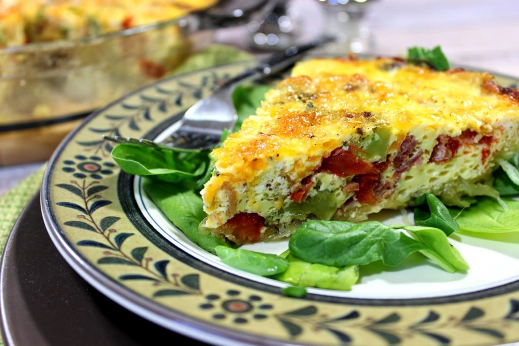 Roasted spaghetti squash is pressed into a pie plate and baked. The "crust" is then filled with veggies, eggs and cheese and baked again. 