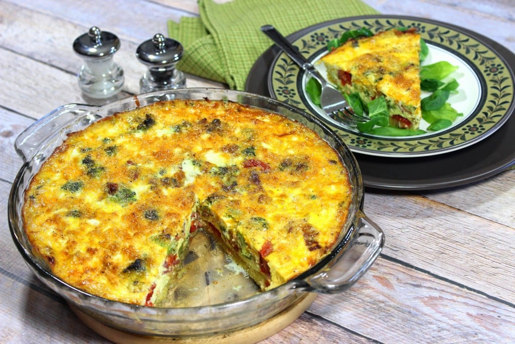 Roasted spaghetti squash is pressed into a pie plate and baked. The "crust" is then filled with veggies, eggs and cheese and baked again. 