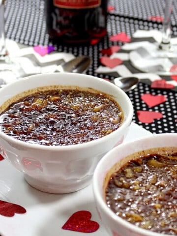 Two small ramekins filled with Chocolate Espresso Creme Brule with a caramelized sugar topping