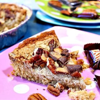 A slice of Retro Heath Bar Cake on a pink polka dot plate.