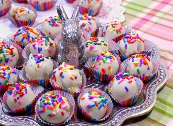 Plate of shortbread cookie truffles with a silver rabbit in the middle.