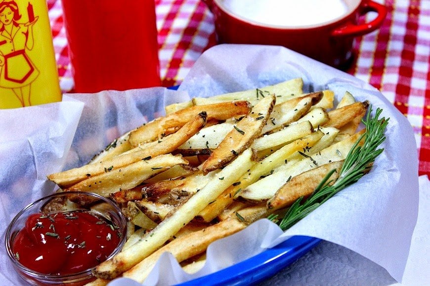 Rosemary French Fries are double fried to make them hot and crispy on the outside, and creamy and soft on the inside.