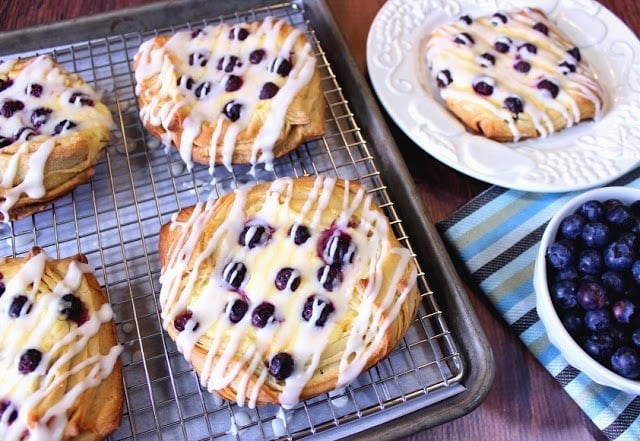 Blueberry Cheese Danish on a baking sheet with a baking rack.