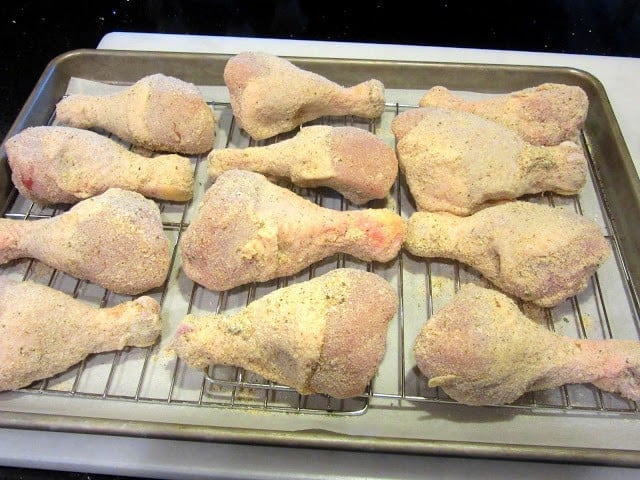 Verticle Image of Breaded Baked Italian Chicken Legs on a white plate 
