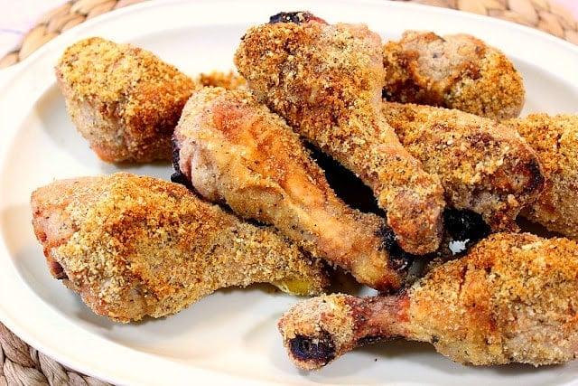 Oval platter full of crunchy Italian baked chicken legs.