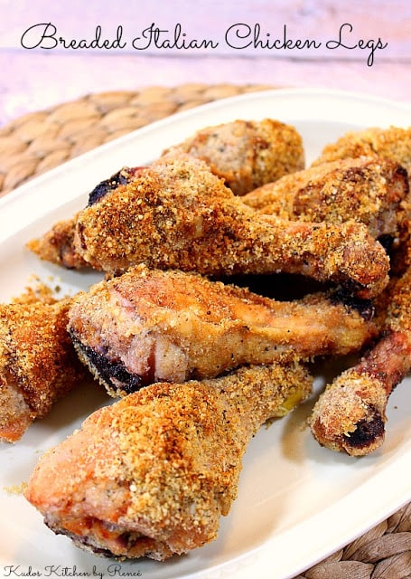 Vertical image of crunchy chicken legs on a cream color platter with text.