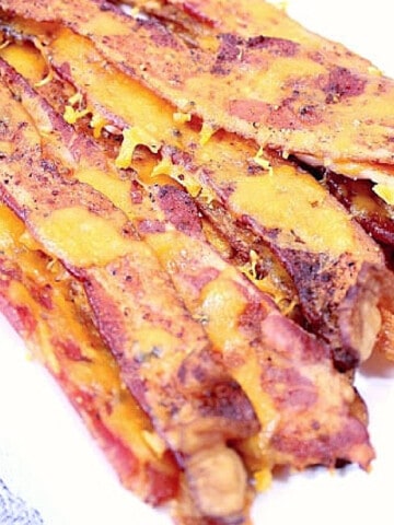 A pile of Cheesy Smoky Bacon on a white plate.