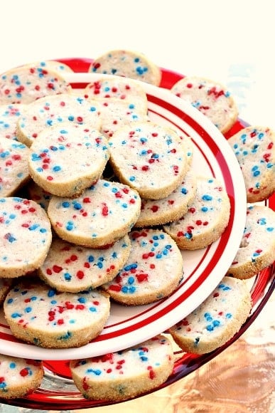 Patriotic Cream Cheese Cookies on a red and white platter