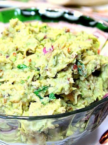 A glass bowl filled with Avocado Chicken Salad