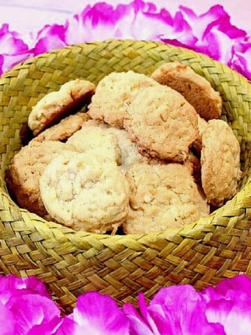 Coconut Macadamia Cookies in a straw hat.
