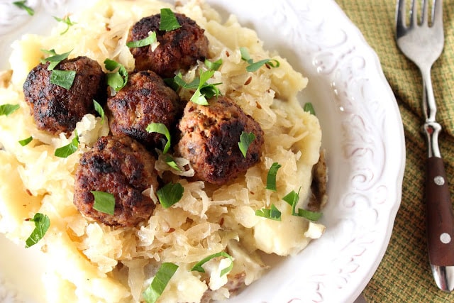 German Meatballs Over Mashed Potatoes and Sauerkraut