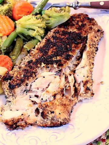 Cashew Coconut Mahi Mahi on a white plate with assorted vegetables.