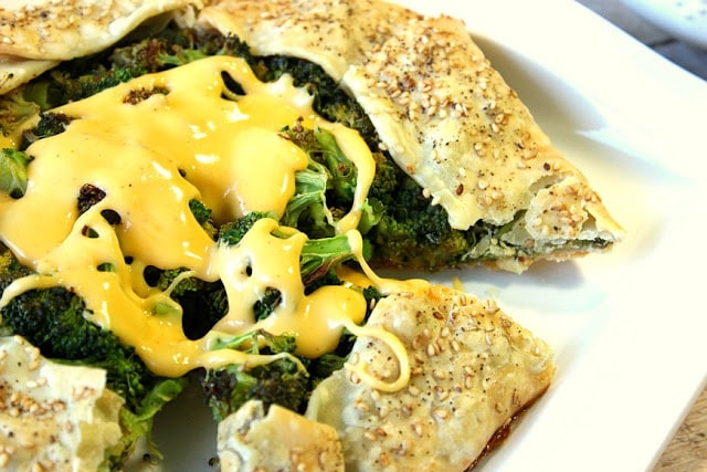 Roasted Broccoli Crostata with Cheese Sauce on a plate.