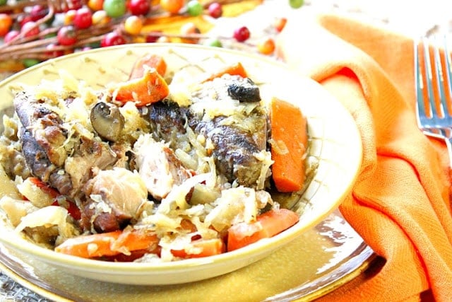 German Pork Ribs and Sauerkraut for the Slow Cooker. German Pork Ribs with Sauerkraut in a bowl with carrots. - kudoskitchenbyrenee.com