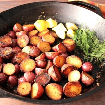 Crispy Red Potatoes with Lemon and Dill in a large cast iron skillet