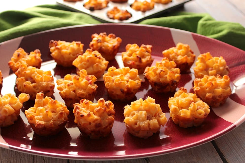 A bunch of Macaroni and Cheese Appetizer Bites on a football platter.