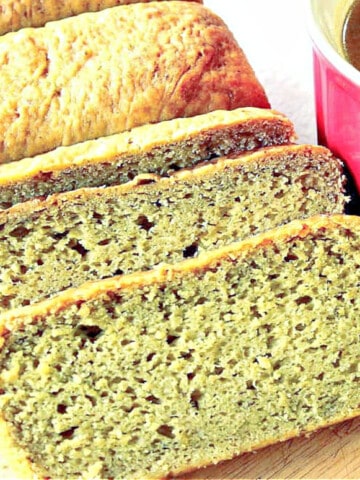 A sliced loaf of Avocado Yeast Bread along with a red mug of soup on the side.