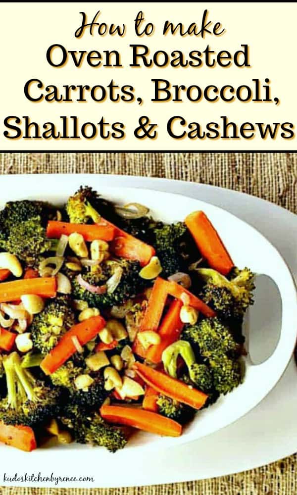 Title text image of oven roasted carrots, broccoli, shallots and cashews in a white bowl with a textured tablecloth.