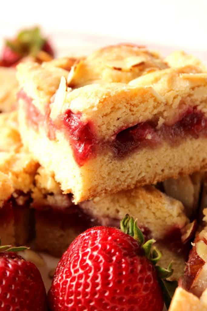 Super closeup photo of the inside of a strawberry cobbler bar.