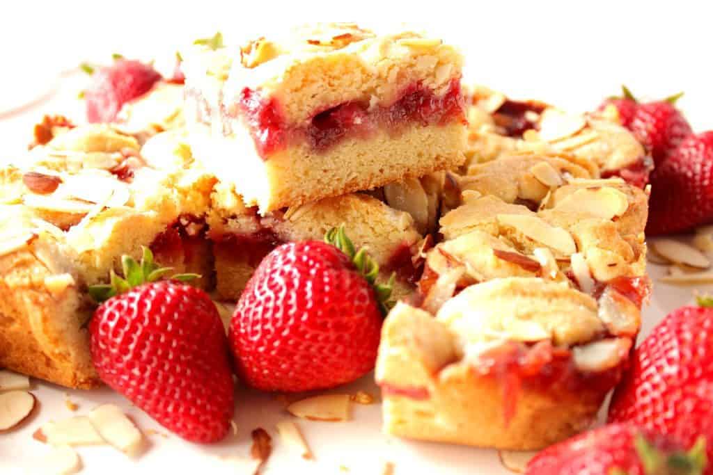 Closeup photo of cut Strawberry Cobbler Dessert Bars.