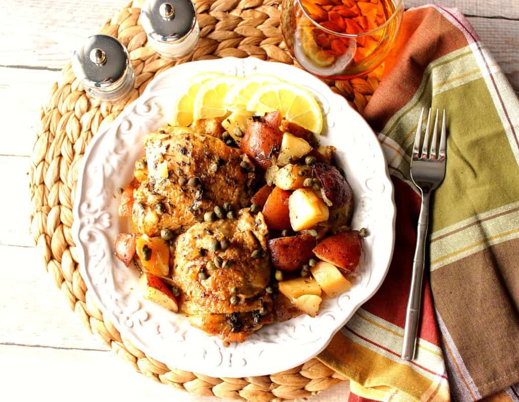 Overhead photo of Slow Cooker Chicken Vesuvio on a white scalloped plate.