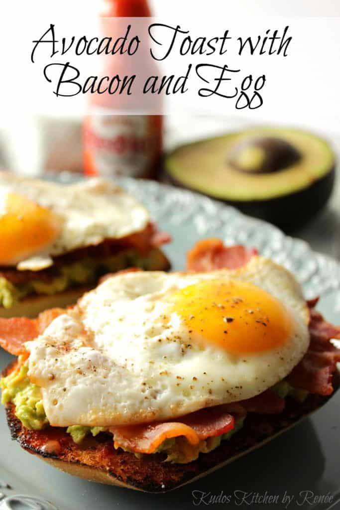 Vertical title text closeup photo of a sunny side up egg on top of Avocado Toast with Bacon.