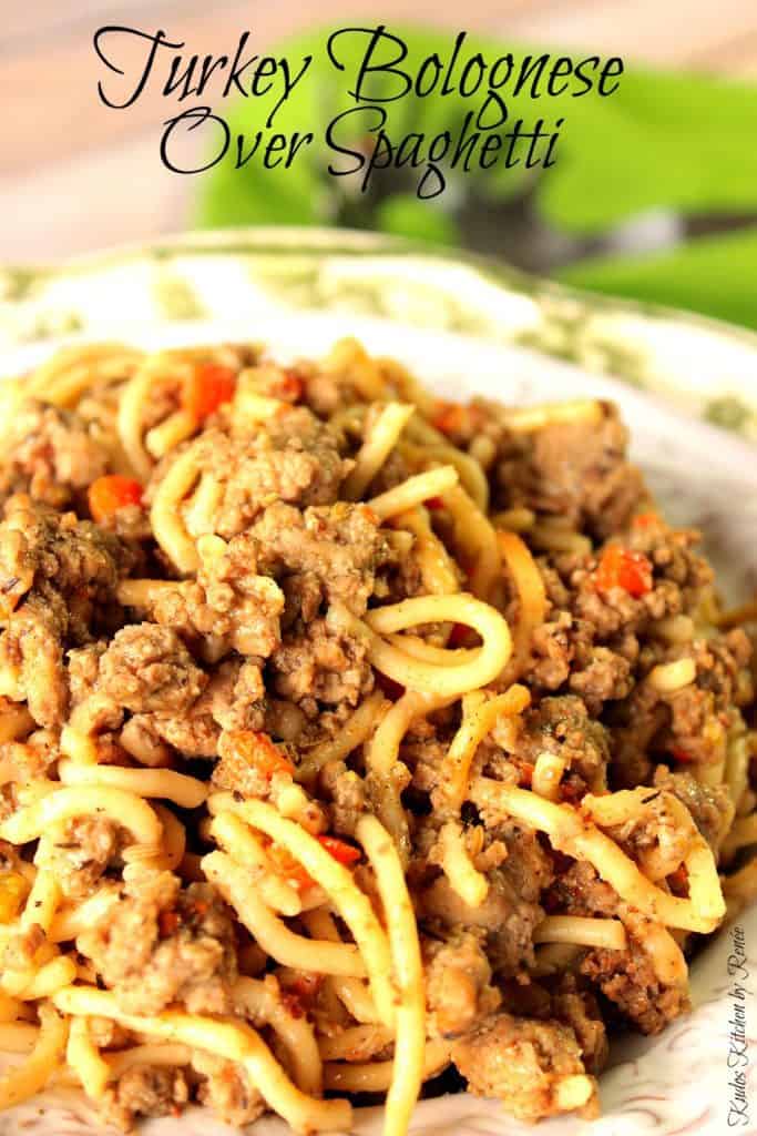 A closeup photo of twisted Spaghetti with Turkey Bolognese mixed in.