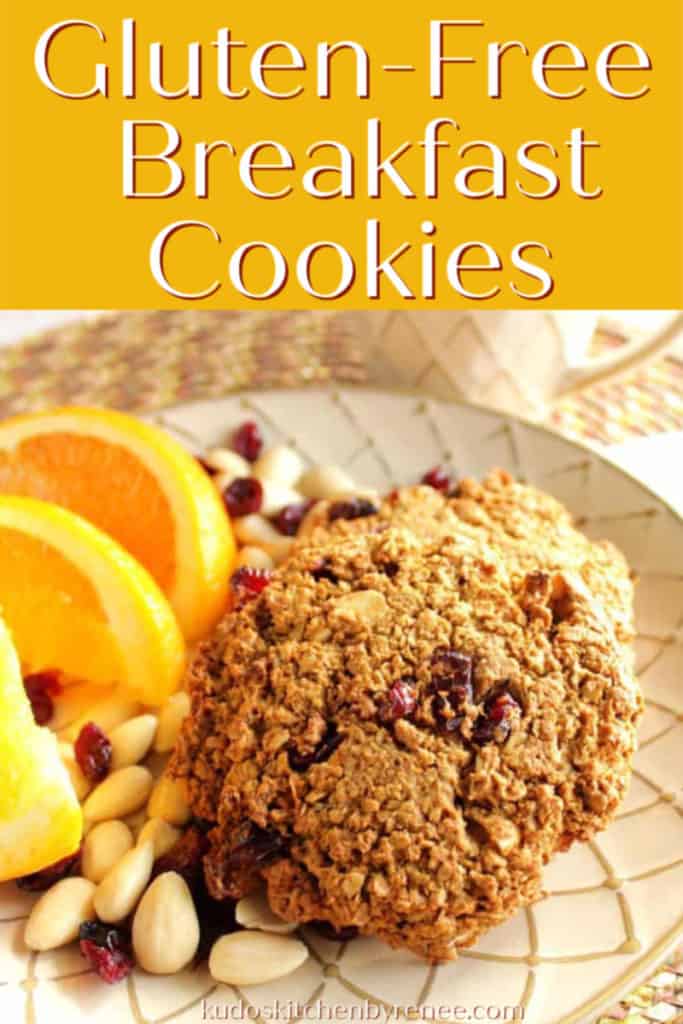Vertical title text image of gluten-free cookies on a plate with oranges, almonds, and cranberries.