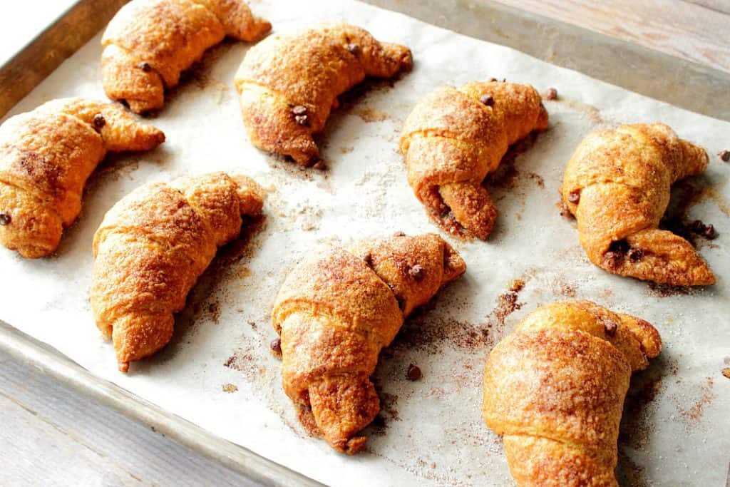 These Super Simple Chocolate Cinnamon Croissants are a speedy weekend breakfast treat that the entire family is sure to love. - Kudos Kitchen by Renee - www.kudoskitchenbyrenee.com Tray of chocolate cinnamon croissants