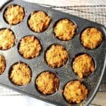 Overhead photo of muffin tin crab cakes in a muffin tin and on a wire rack.