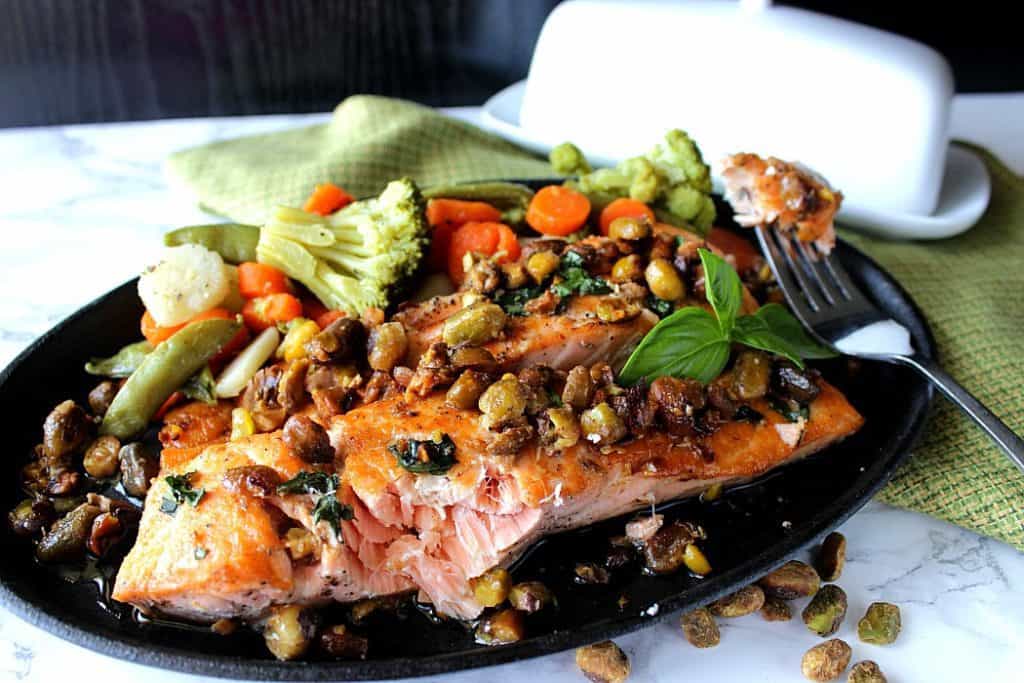 This recipe for Seared Salmon Fillets with Pistachio Basil Butter is elegant enough for company, and yet easy enough for a busy weeknight. - Kudos Kitchen by Renee - www.kudoskitchenbyrenee.com Seared Salmon Fillets with Pistachios