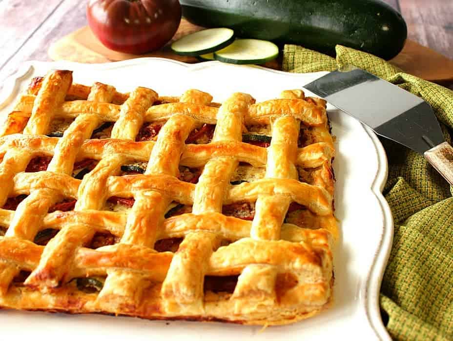 flaky puff pastry tomato zucchini tart with lattice top