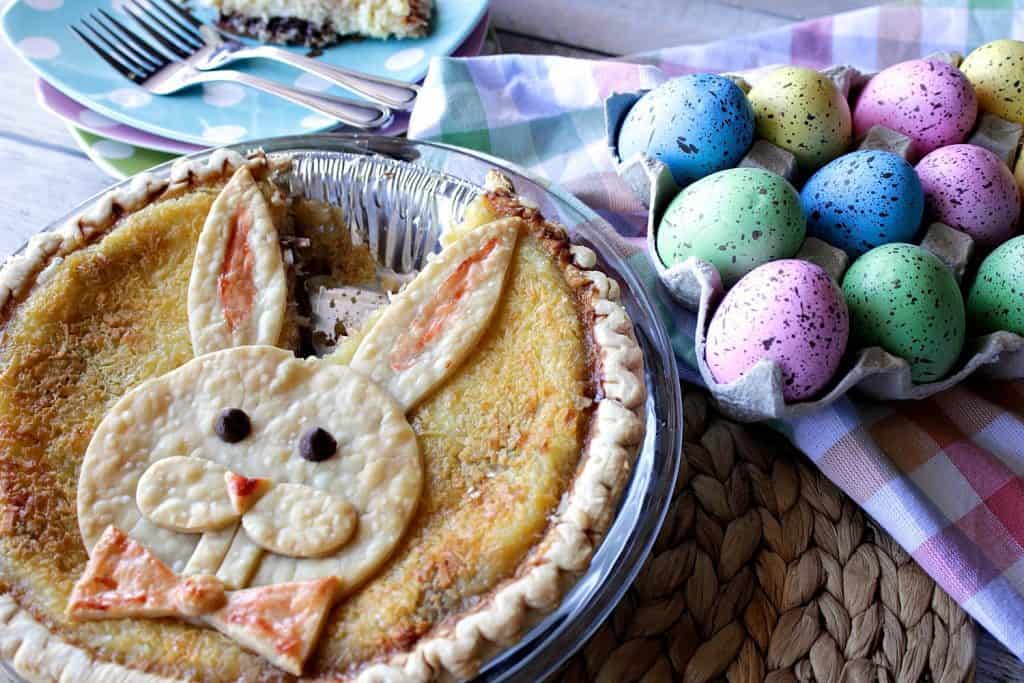 Easter Bunny Pie in a pie tin with a slice taken out between his ears. 