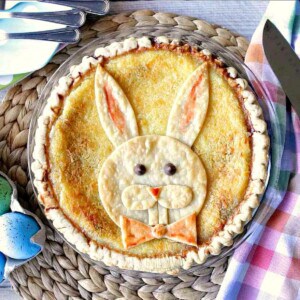 A cute Coconut Custard Easter Bunny Pie with a bow tie.