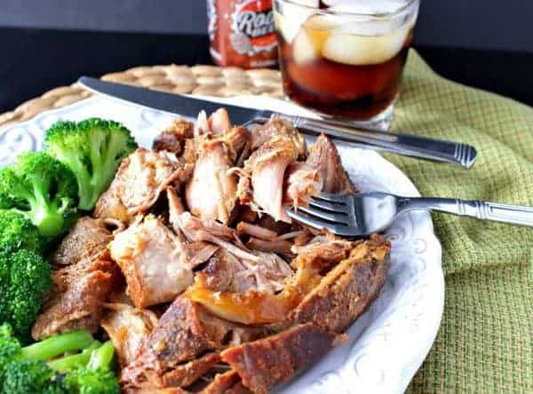 Slow Cooker Root Beer Country Ribs on a white plate with broccoli.