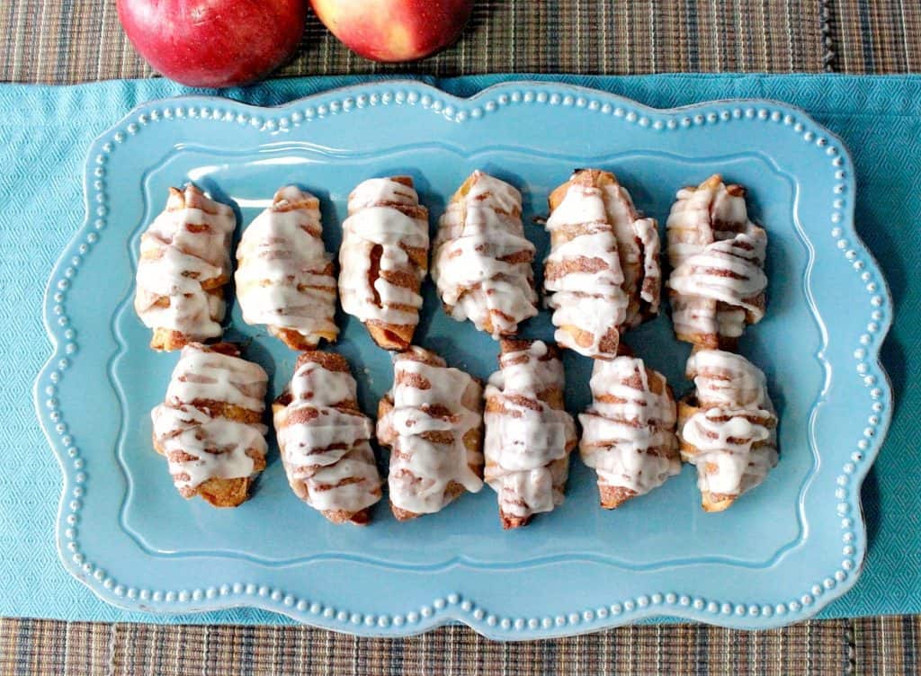 Overhead horizontal photo of Cinnamon Sugar Apple Pie Wedges on a blue platter.