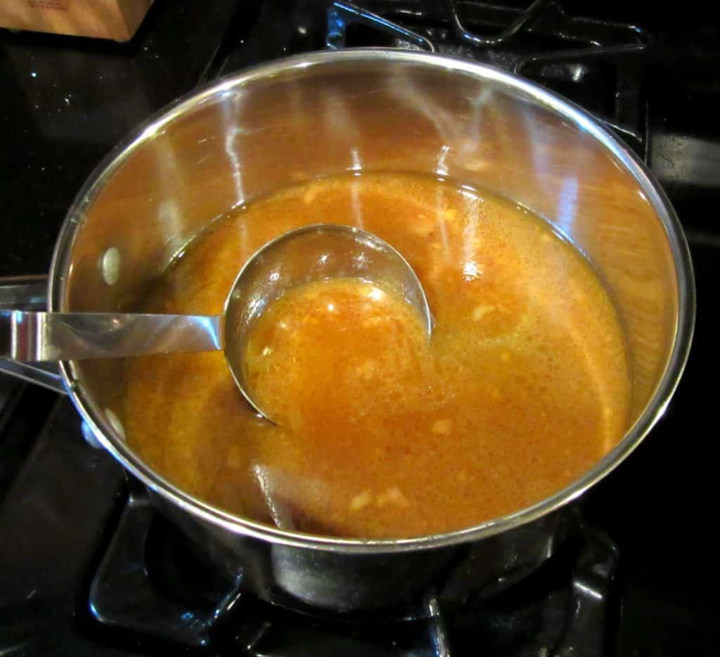 Simmering a sauce on the stovetop.