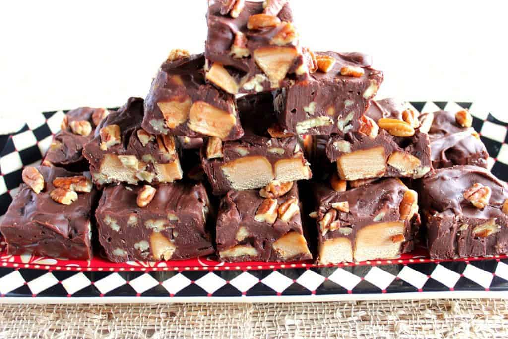 A stacked plate of Chocolate Caramel Turtle Fudge