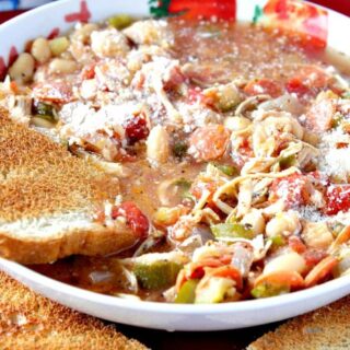 Italian pepperoni soup in a round bowl with a slice of toast on the side.