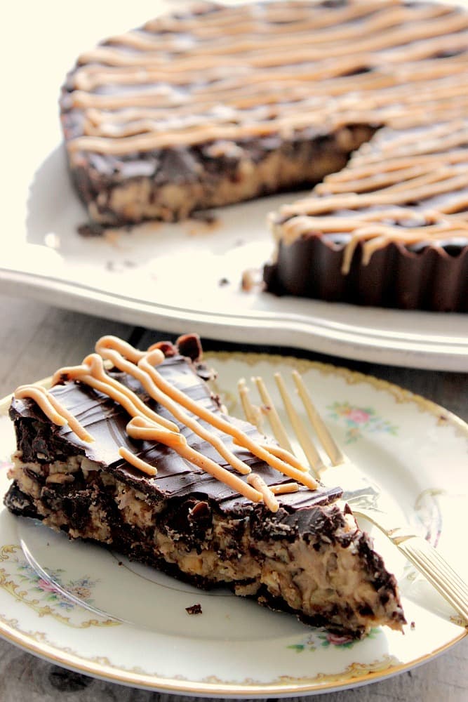 Giant Peanut Butter Cup Slice on a plate with a fork